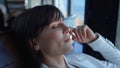 Dreamy woman face relaxing office armchair closeup. Employee resting work break Royalty Free Stock Photo