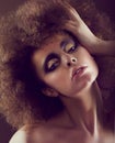 Dreamy Woman with Frizzy Hairstyle and Golden Eyeshadow Royalty Free Stock Photo