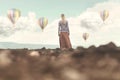 Dreamy woman looking at the hot air balloons coming down