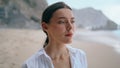 Dreamy woman relaxing beach at cloudy day close up. Happy girl standing seashore Royalty Free Stock Photo