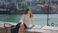 Dreamy woman relaxing sunny promenade alone. Romantic girl looking camera posing Royalty Free Stock Photo