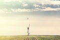 Dreamy woman walking towards infinity with his white balloon