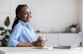 Dreamy Young Black Busines Lady Having Coffee Break At Workplace In Office Royalty Free Stock Photo