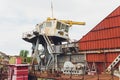 Dredger for absorption of trailer bunker during work on land reclamation for new ports. Suction dredge. Dredging in
