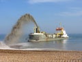 Dredger replenishing beach at Eastbourne, England, Uk