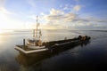 Dredger vessel in the Wadden Sea preventing the fairway from silting up