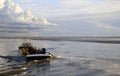 Dredger vessel in the Wadden Sea preventing the fairway from silting up