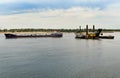 Dredging platform and cargo ship