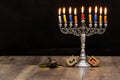 Dreidels and a menorah. Hanukkah. Text-Israel Royalty Free Stock Photo