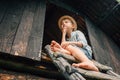 Dreming boy sits on the barn leader Royalty Free Stock Photo