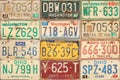 Retro styled image of old car license plates on a wall Royalty Free Stock Photo