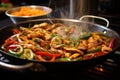 drenching sizzling pan of fajitas in zesty marinade