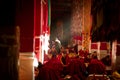 Drepung Monastery monks in sunbeams Lhasa Tibet