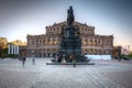 Dresden, Germany - April 19, 2019: Semperoper Opera and King John of Saxony monument at sunset, Dresden. Germany
