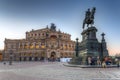 Dresden, Germany - April 19, 2019: Semperoper Opera and King John of Saxony monument at sunset, Dresden. Germany