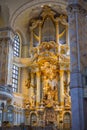 Dresden, Germany - June 28, 2022: Inside the church of our Lady or Frauenkirche Dresden. Golden Interior with view of altar in the