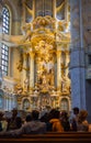Dresden, Germany - June 28, 2022: Inside the church of our Lady or Frauenkirche Dresden. Golden Interior with view of altar in the