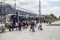 People hurry to work train and tram