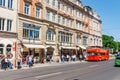 Classic red city sightseeing bus in Dresden, near Pfunds milk Shop, famous tourist destination