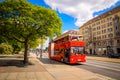 Classic red city sightseeing bus at the street of Dresden