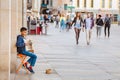 Street musician kid performing music for donating money and coins Royalty Free Stock Photo