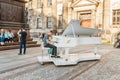 Street musician piano player performing music for donating money and coins Royalty Free Stock Photo