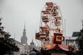 Dresden, Saxony, Germany, 10 December 2022: Christmas outdoor market stall decorations with fairy with lights, wooden ferris wheel