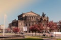 Dresden Semper Opera theatre Semperoper, front view in spring. Blooming branches on foreground. Royalty Free Stock Photo