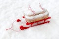 Dresdner Stollen, German Christstollen, on Red Wooden Sledge in Snow