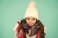 Dress in layers and wear hat. Stay active. it is cold outside. kid warm knitwear. winter vibes. Portrait of smiling girl Royalty Free Stock Photo