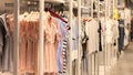 Dress in the store, fashion clothing on hangers at the shop Royalty Free Stock Photo