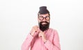 Dress for success. Man bearded hipster hold cardboard top hat and eyeglasses to look smarter white background