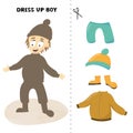 Dress up boy, game for children. Cute cartoon kid with hat and rubber bands. Worksheet for autumn and winter season.