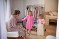 Dress up, fun and mother with children in home for makeover, getting ready and clothing. Family, wardrobe and mom and Royalty Free Stock Photo