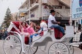 Dressed in costumes participants of ÃÂarnival parade ride in car