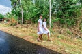 Dressed in a while lama sariÃ¢,young buddhist local sri lankan girals going to boodhist school