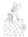 Dressed mouse sits on a big christmas gift box and reads a book