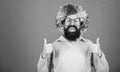 Dressed up for birthday party. Man in fashion wig gesturing thumbs up. Bearded man in clown wig hairstyle. Hipster man