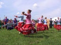 Dressed female entertainers dancing in the meadow at the village festival 2013 Kolyvan