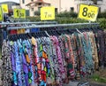 dresses  and colorful blouses made of cotton or polyester fabric hanging on hangers for sale in the open-air market in winter Royalty Free Stock Photo