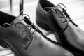 dressing the groom. Business man dressing up with classic, elegant shoes. Royalty Free Stock Photo