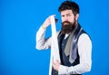 When dressing in suit necktie often add dash of flavor to overall outfit. Guy with beard choosing necktie. Perfect white