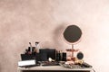 Dressing table with beauty accessories in room Royalty Free Stock Photo