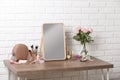 Dressing table with different makeup products and accessories