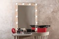 Dressing table with different makeup products and accessories Royalty Free Stock Photo