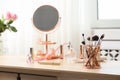 Dressing table with different makeup products and accessories Royalty Free Stock Photo