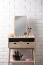 Dressing table with different makeup products and accessories Royalty Free Stock Photo