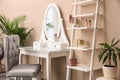 Dressing table with mirror in room interior Royalty Free Stock Photo