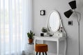 Dressing table with mirror in room interior Royalty Free Stock Photo