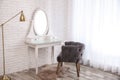 Dressing table with mirror in room interior Royalty Free Stock Photo